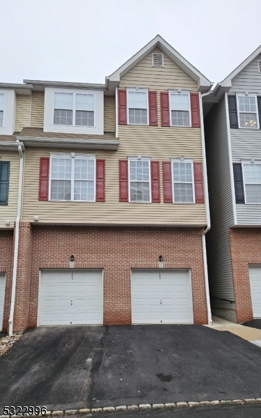 a front view of a house with a garage