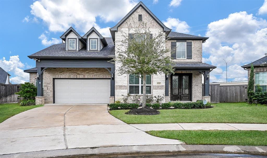 Grand, indeed! Not because 'grand' is part of the address, but GRAND because this 2-story, brick/stone residence is a masterpiece! It's located in a cul-de-sac at 6327 Grand Drift Court, Katy, TX, in the Grand Lakes Crossing gated community.