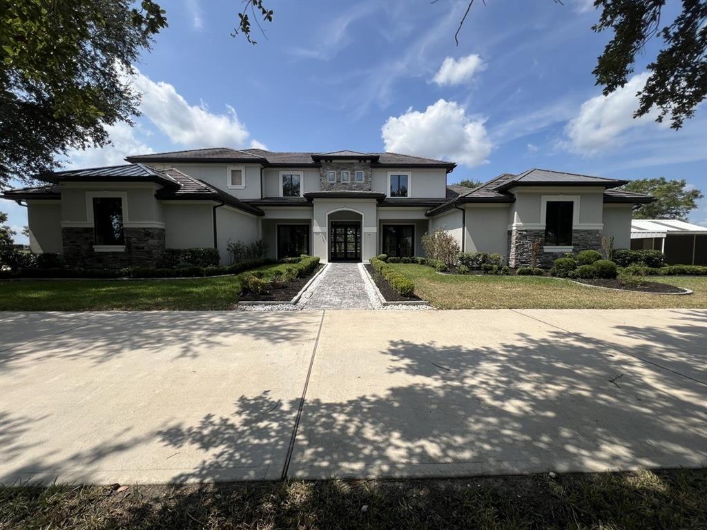 a front view of a house with yard