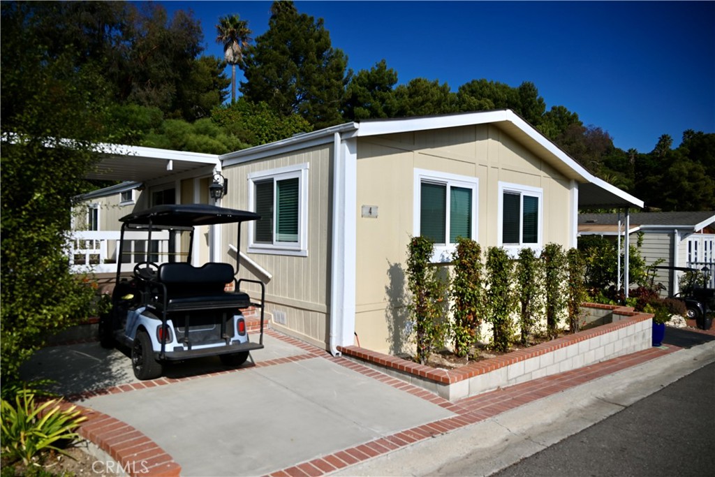 a view of house with outdoor space and porch