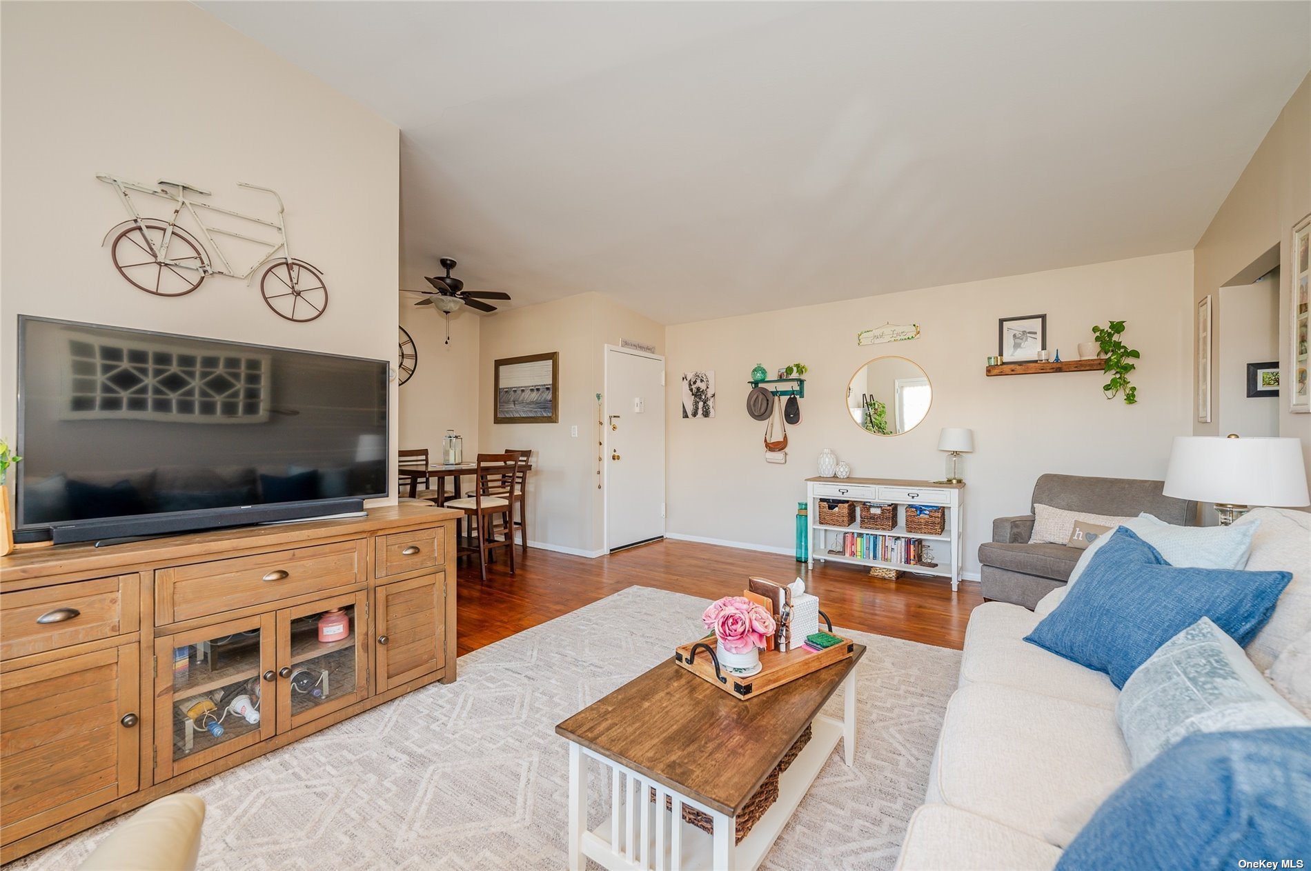 a living room with furniture and a kitchen view