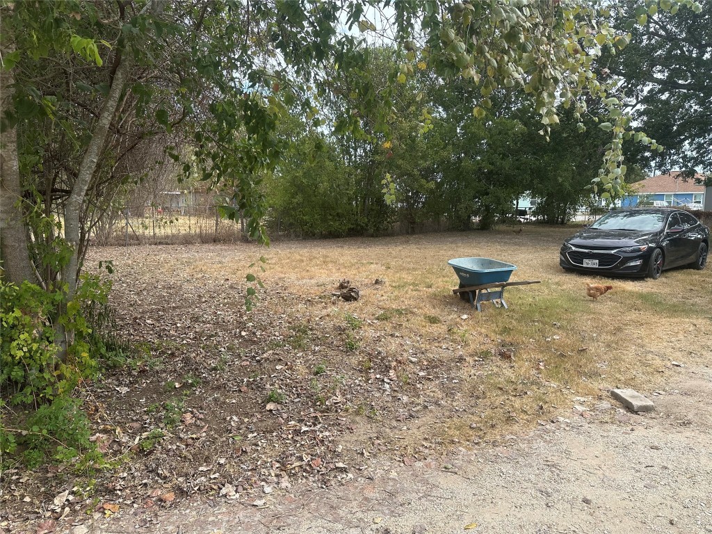 a view of back yard with outdoor seating