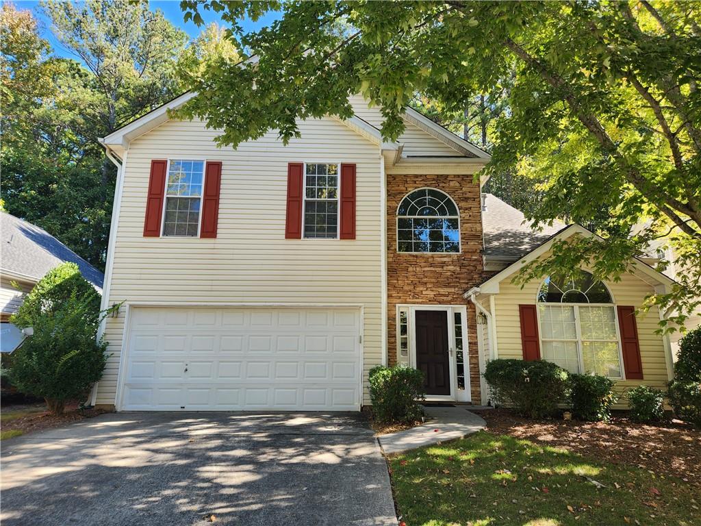 front view of a house with a yard