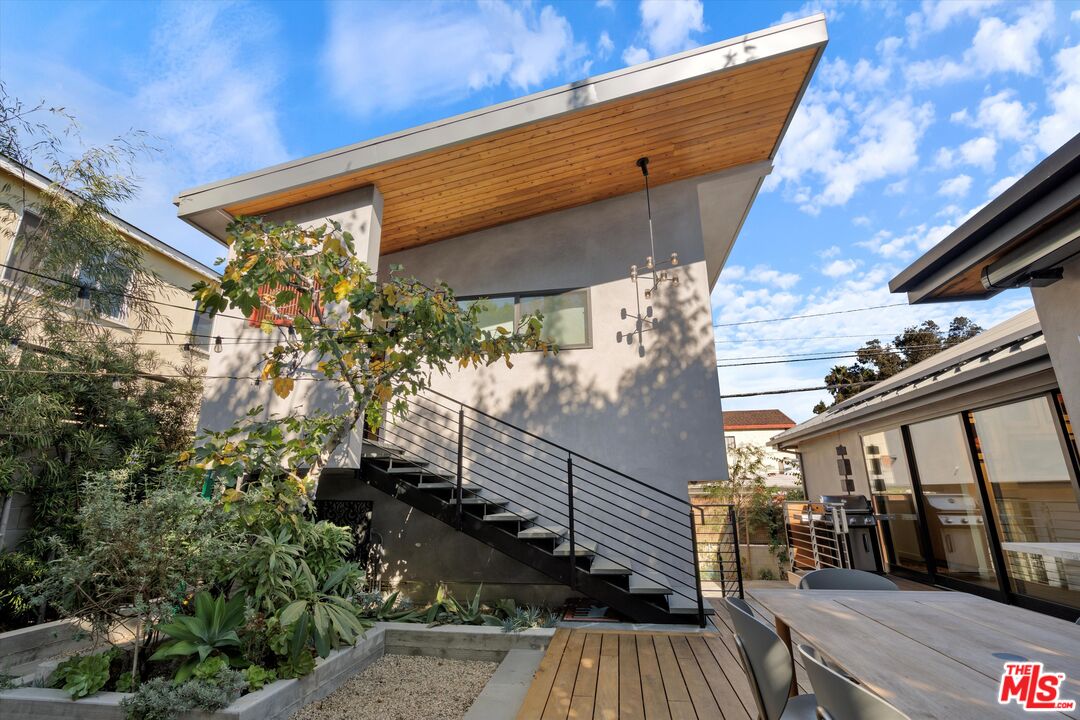 a view of balcony with wooden floor