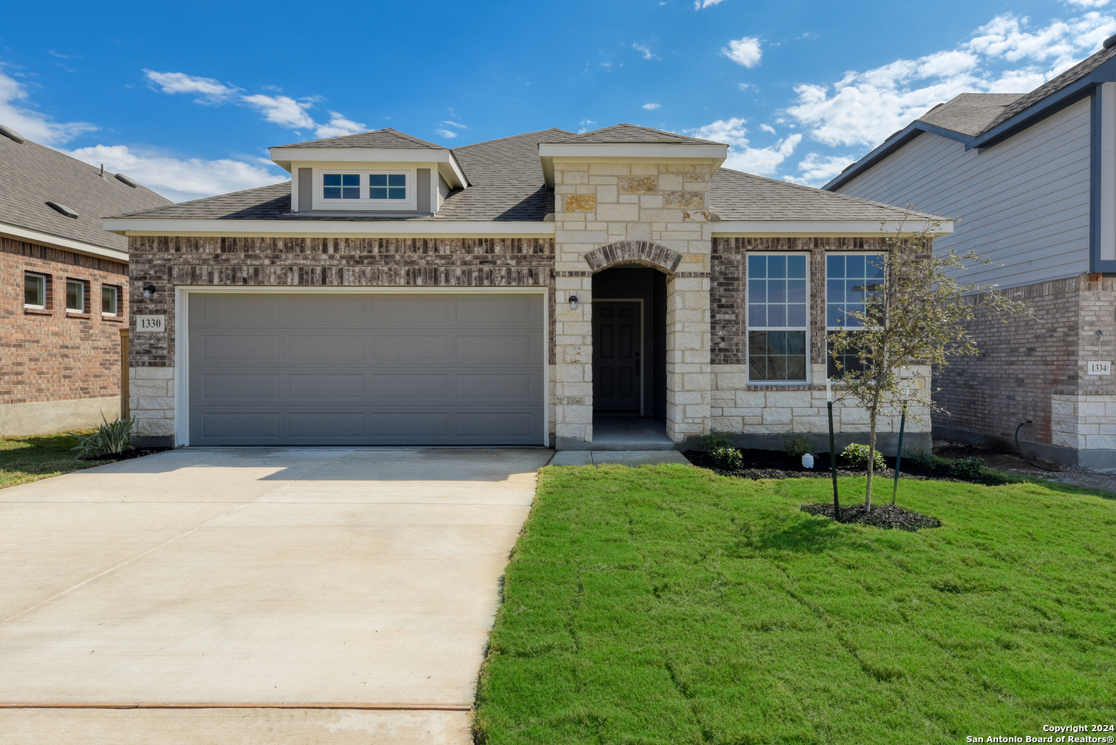 front view of a house with a yard