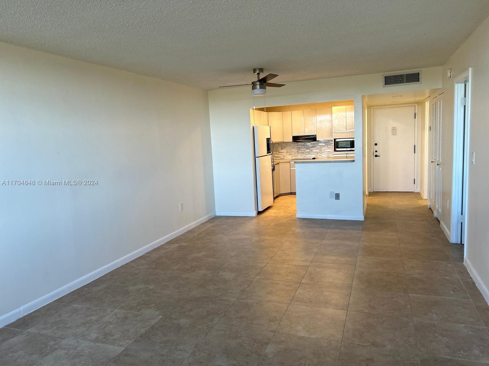 a view of a kitchen with a sink