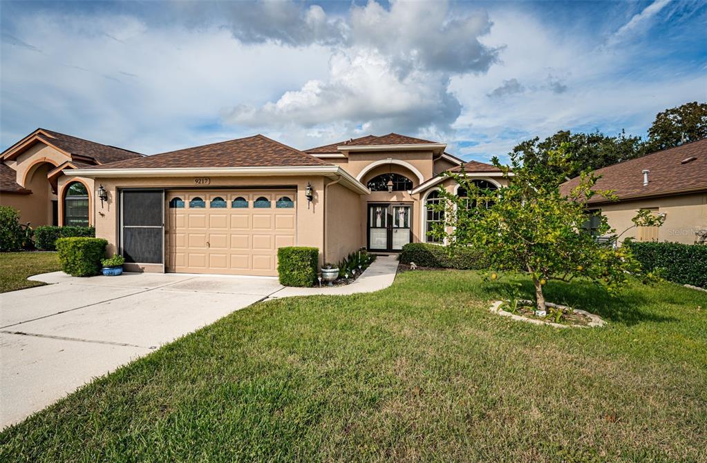 a front view of a house with a yard