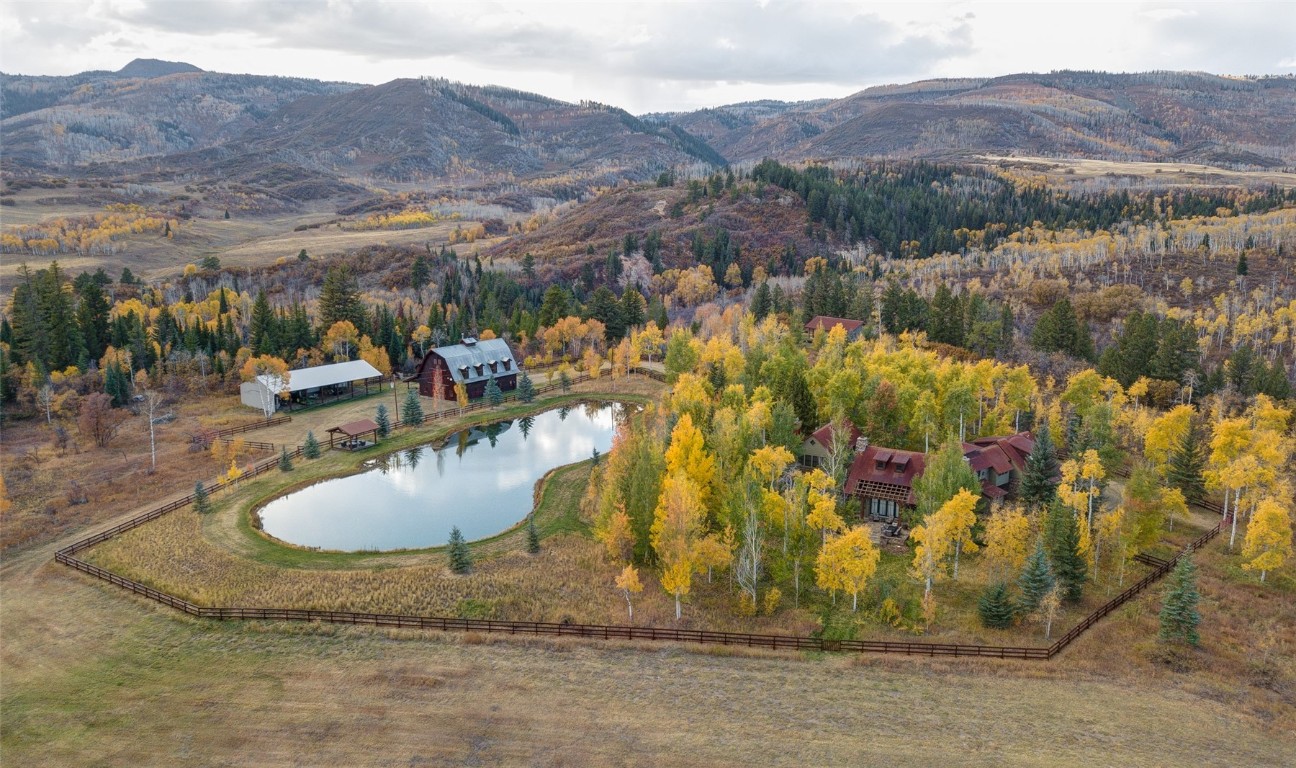 Drone / aerial view with a water and mountain view