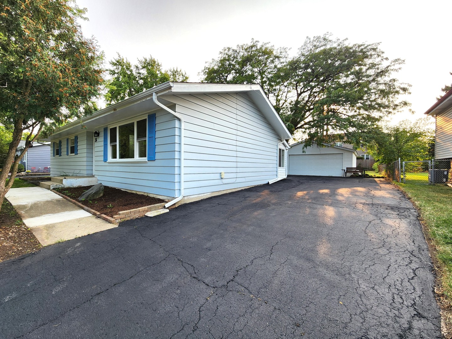 a view of a house with a yard and garage