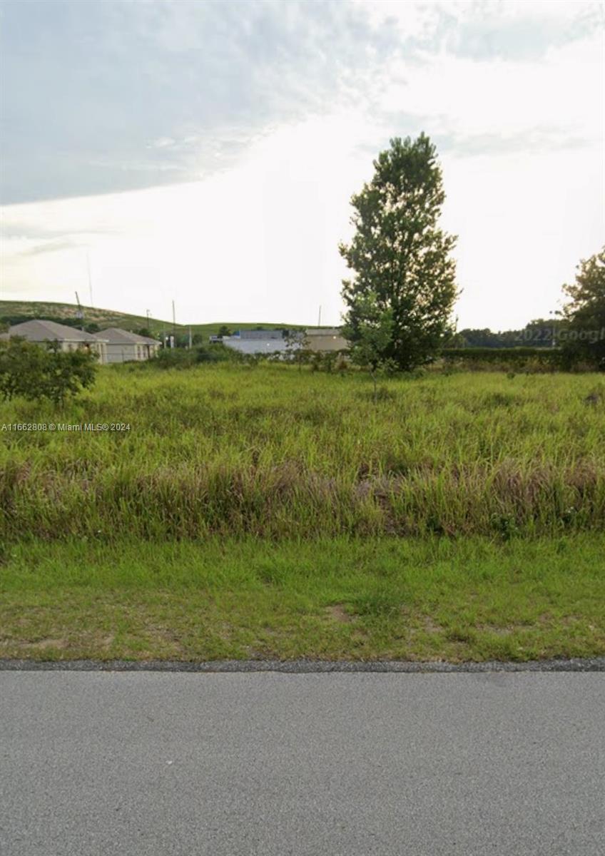 a view of a lake with a big yard