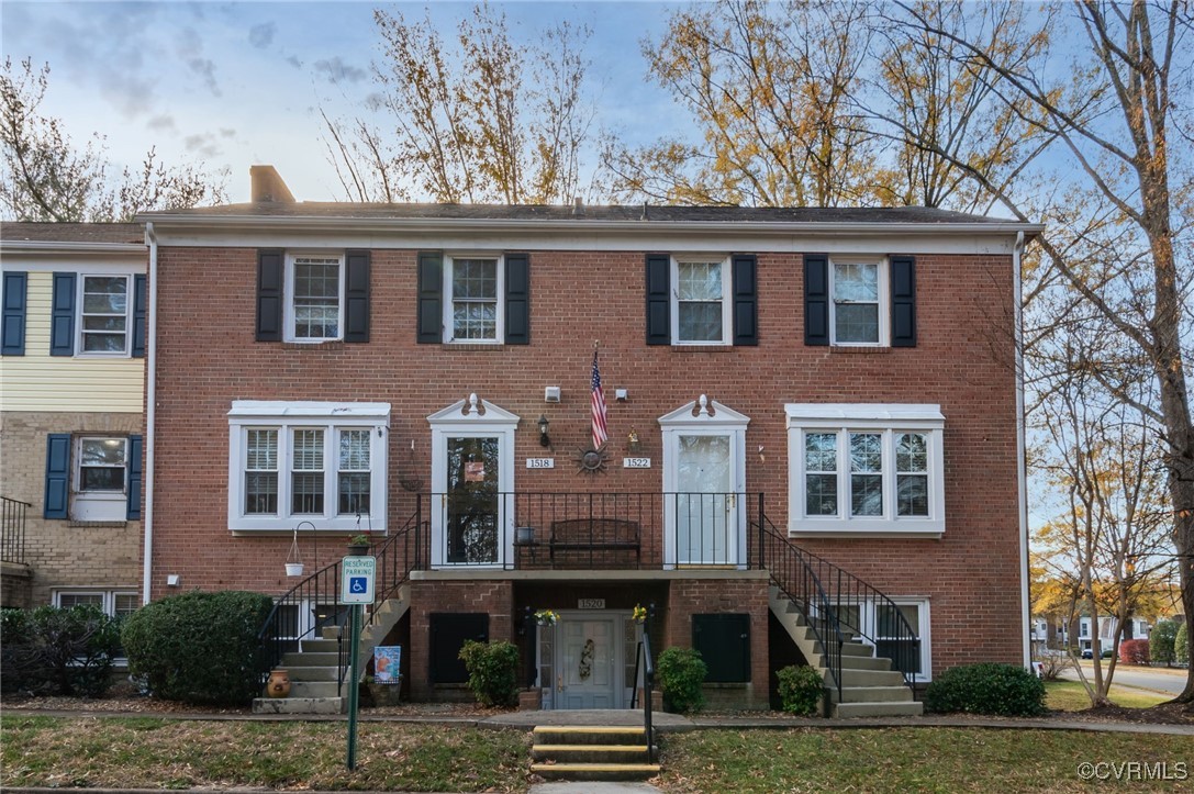 a front view of residential houses with yard