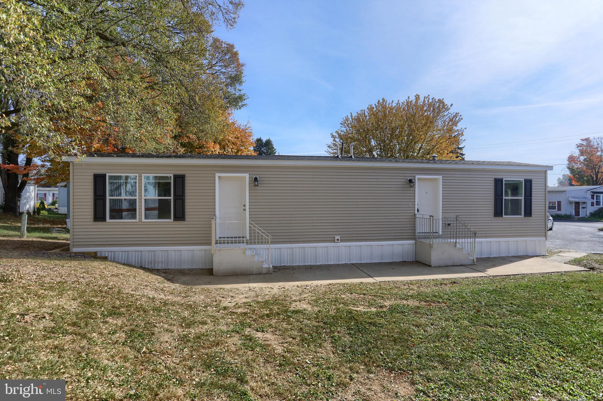 front view of a house with a yard