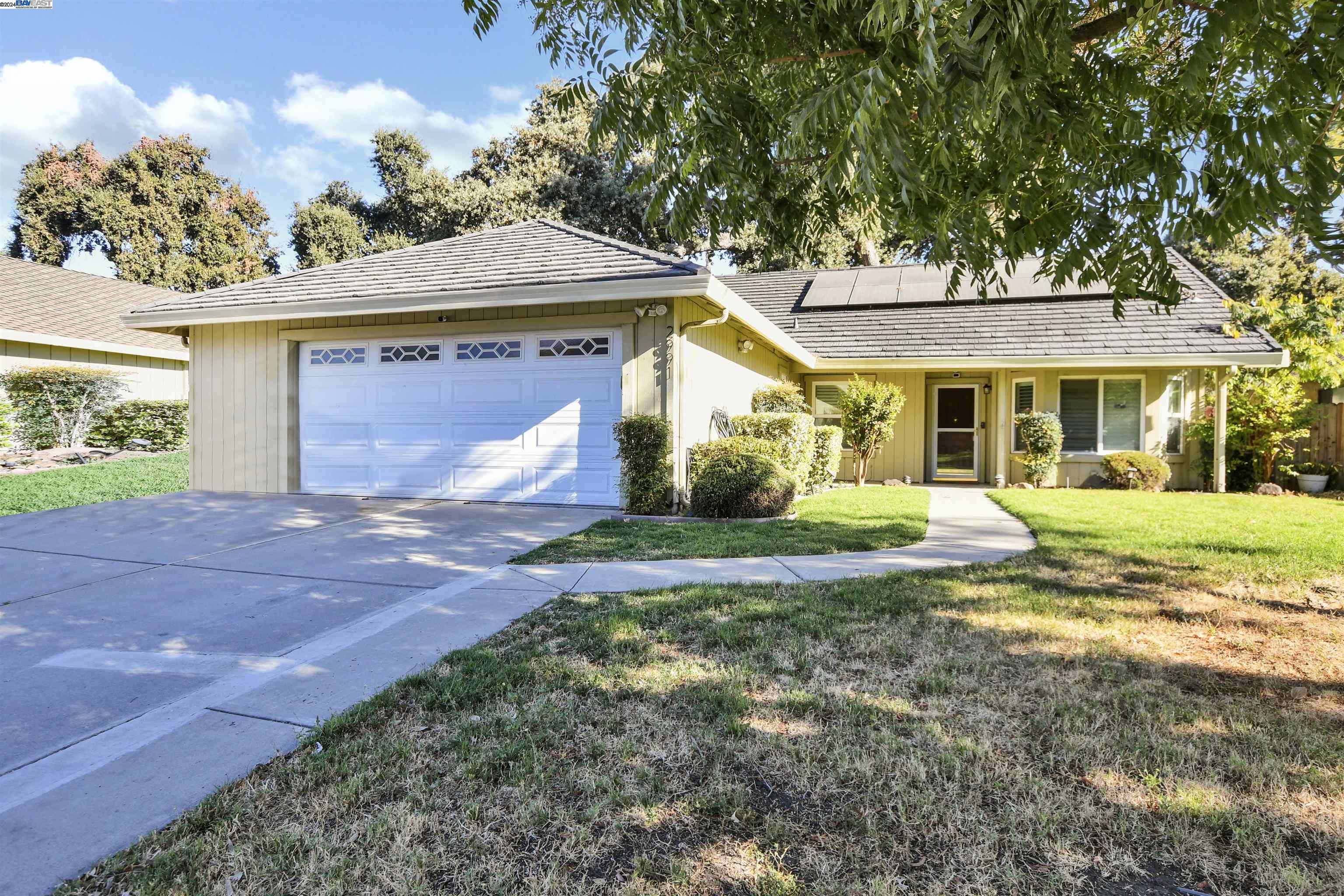 a view of a house with a yard