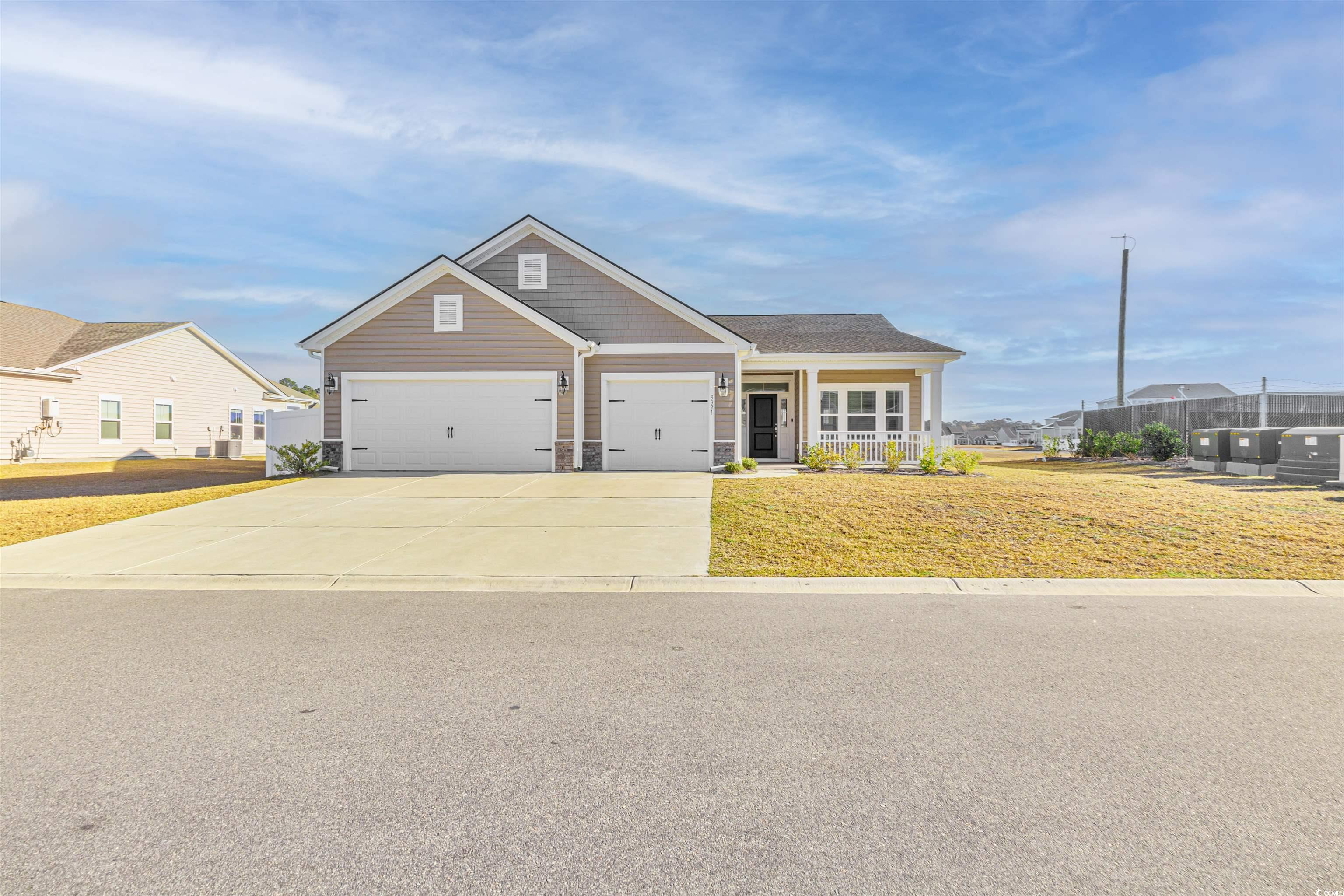 Craftsman-style house with cooling unit, a garage,