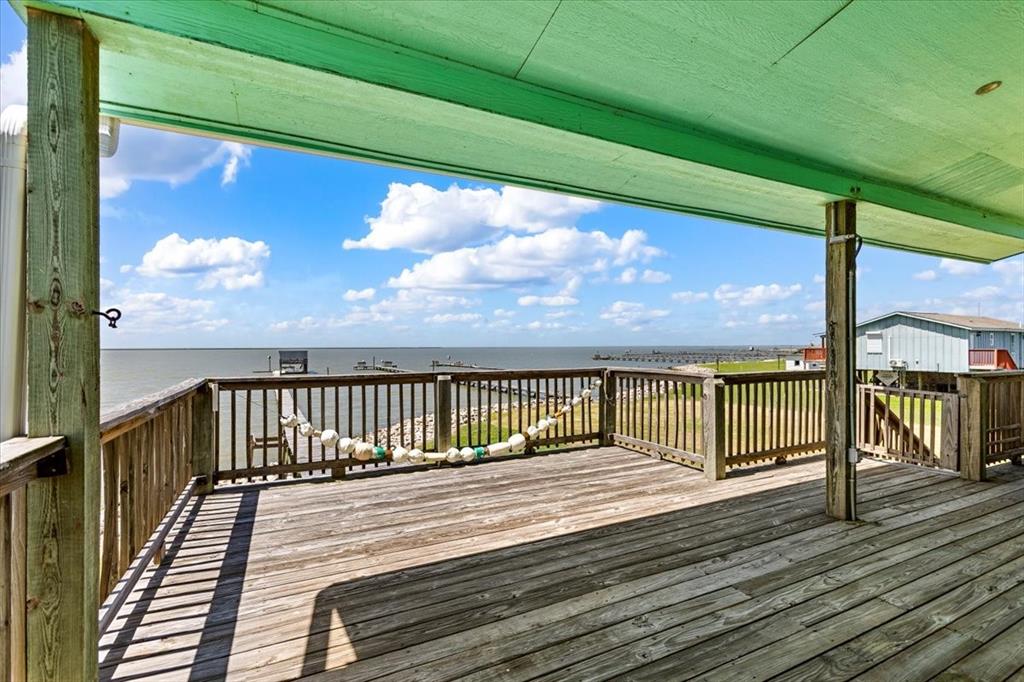 a view of balcony with wooden floor