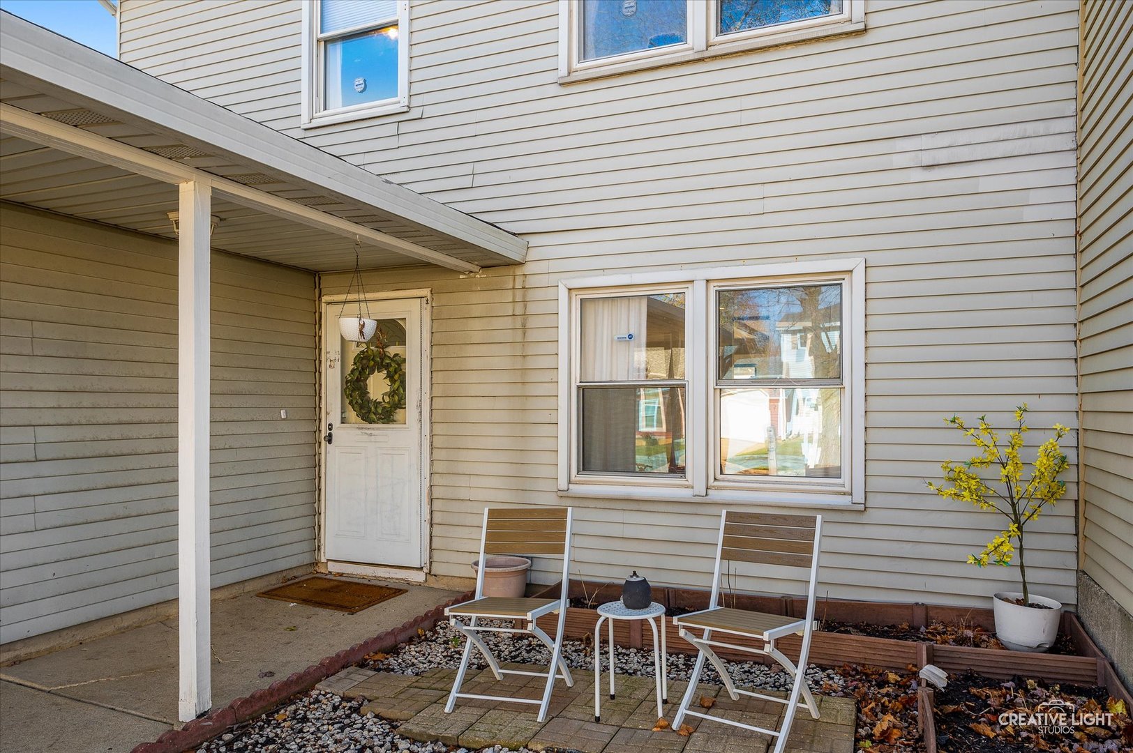 a view of an outdoor space with porch and windows