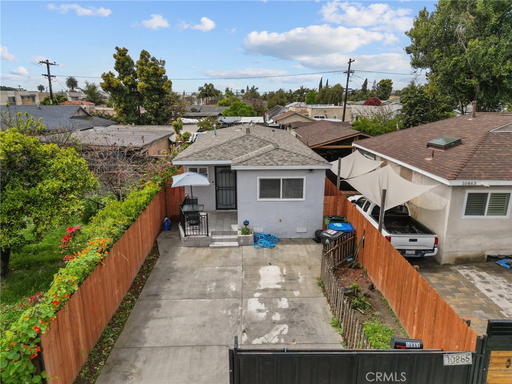 a aerial view of a house with a yard