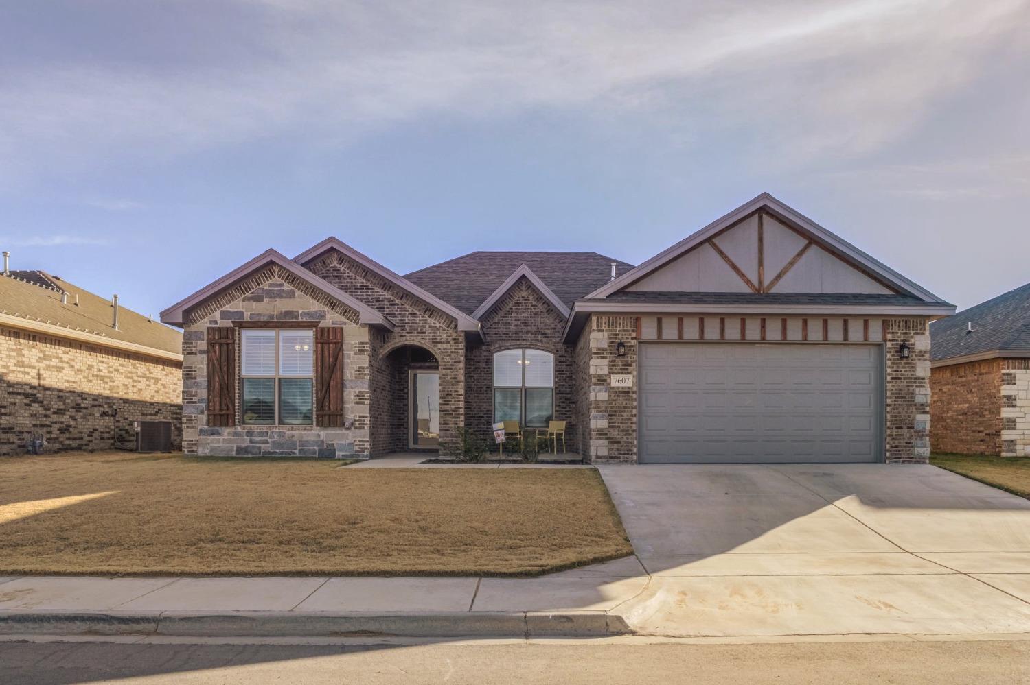 a front view of a house with yard