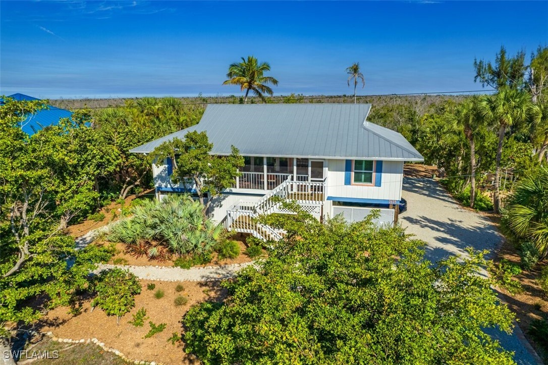 a aerial view of a house with a yard