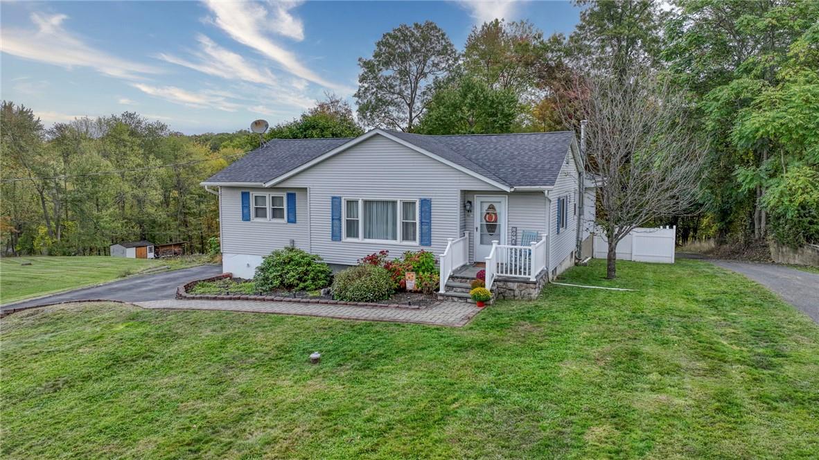 a house that is sitting in the grass