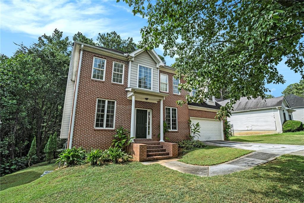 front view of a house with a yard