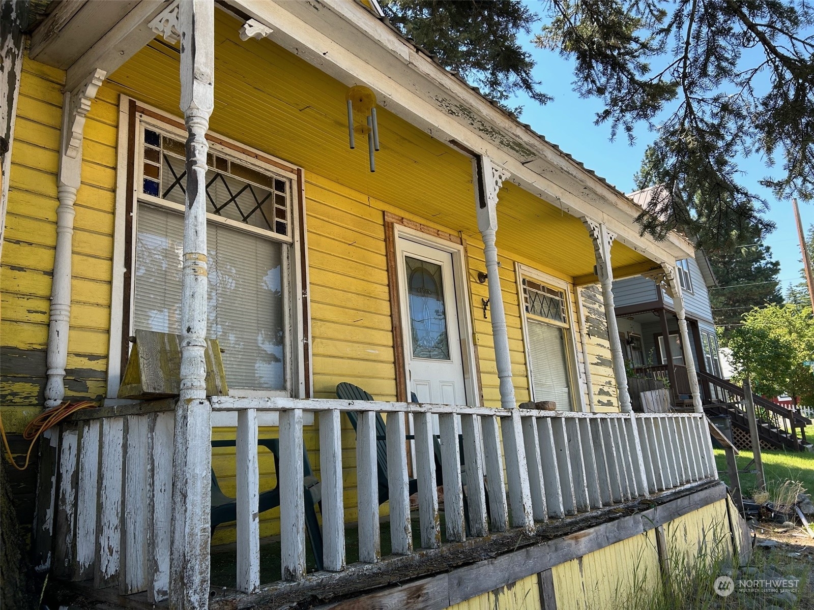 a view of a house with wooden fence