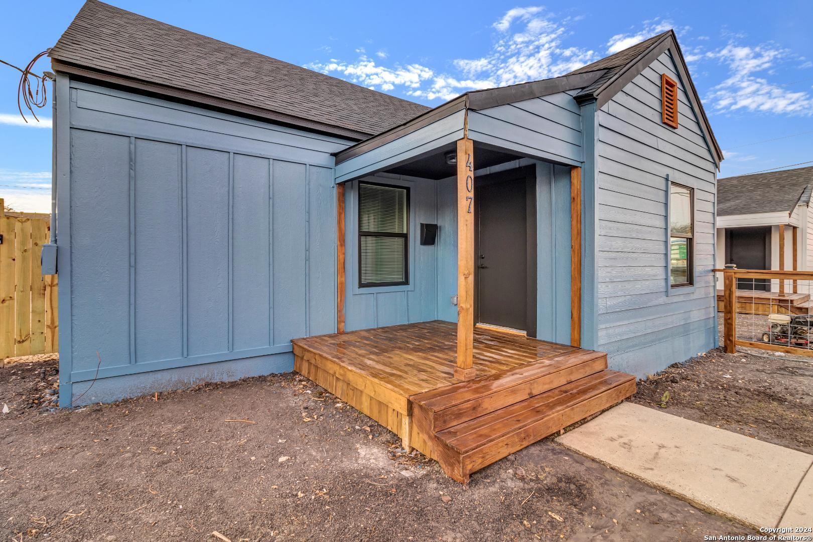 a bed sitting in front of a house