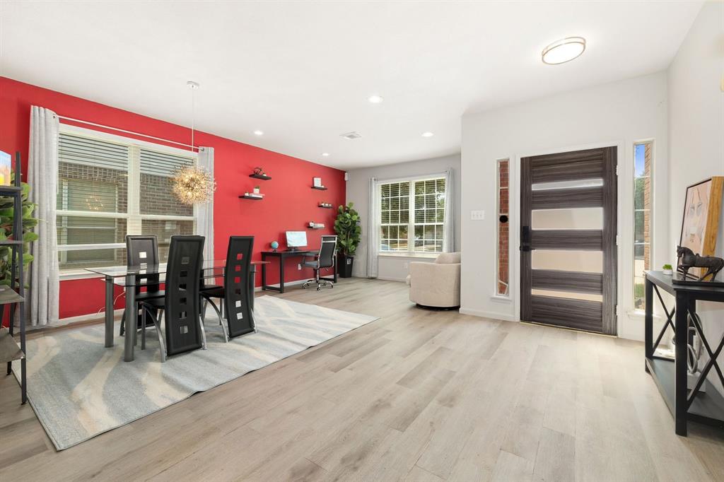 an empty room with furniture and musical instruments