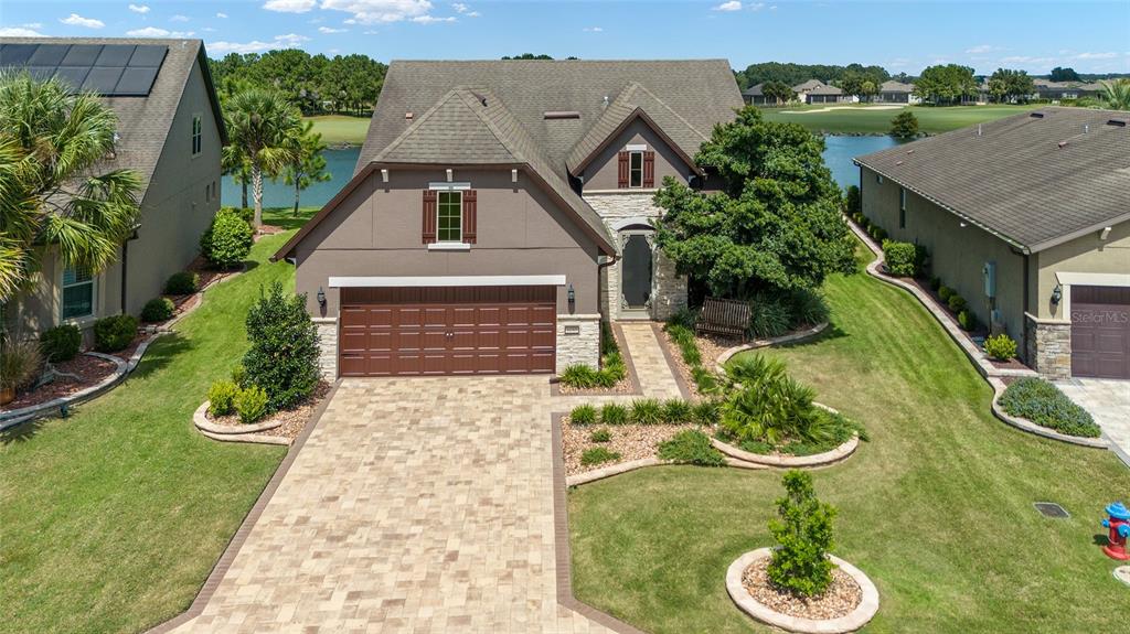 a aerial view of a house with yard