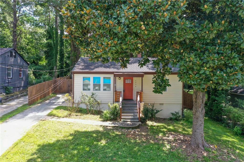 front view of a house with a yard