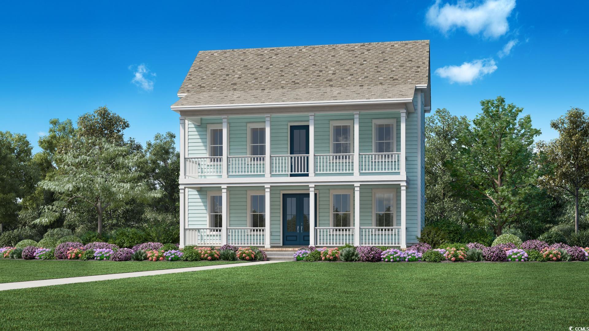 View of front facade with a front lawn and covered