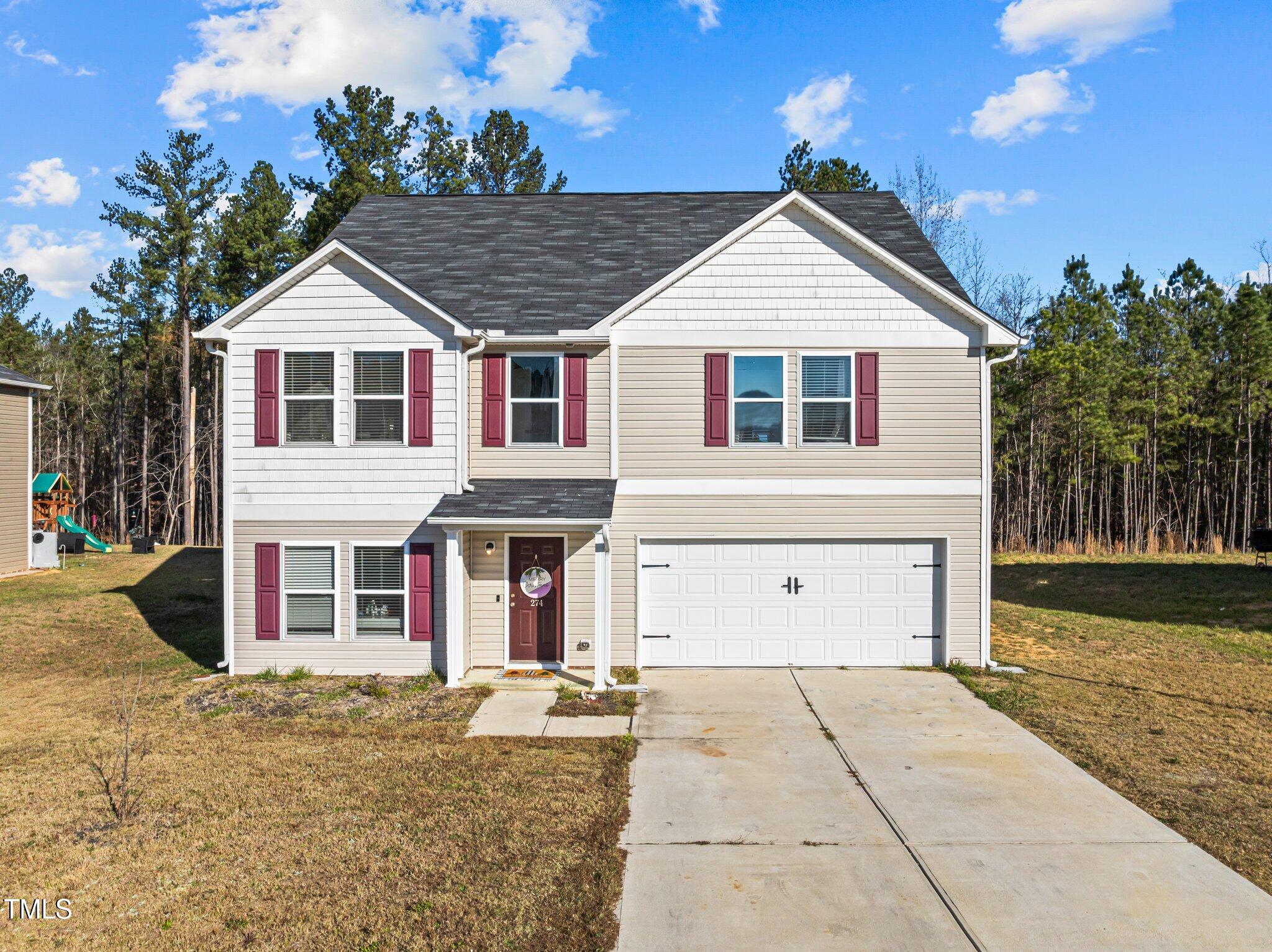 front view of a house with a yard