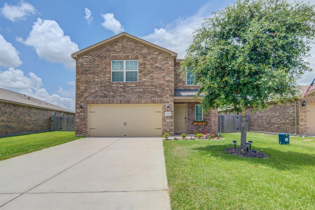 Front side view of 2315 Oyster Bay Avenue. Two story home complete with a spacious double driveway and a garage to fit two vehicles if need be.