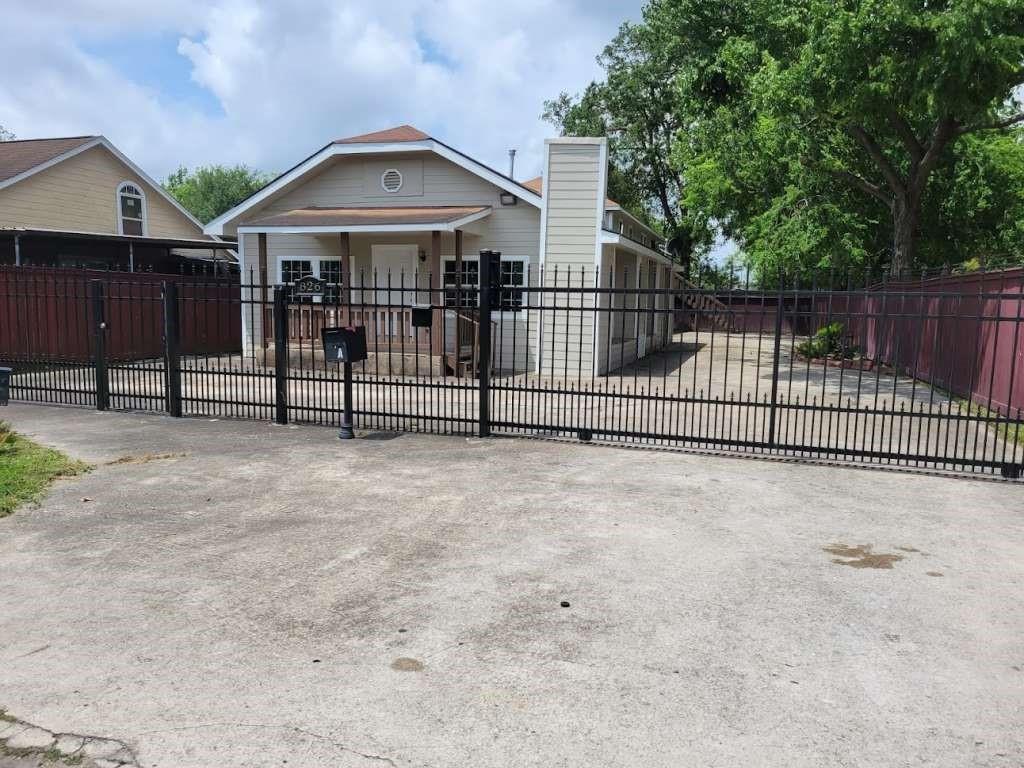 a view of a wrought iron fences in front of house