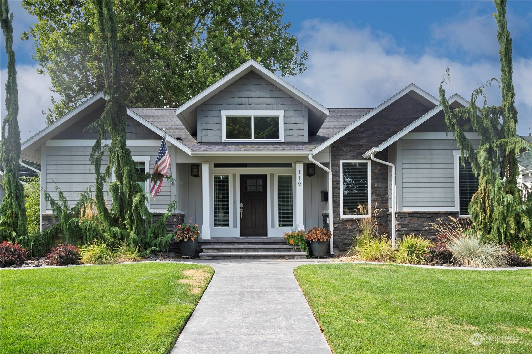 a front view of a house with a yard