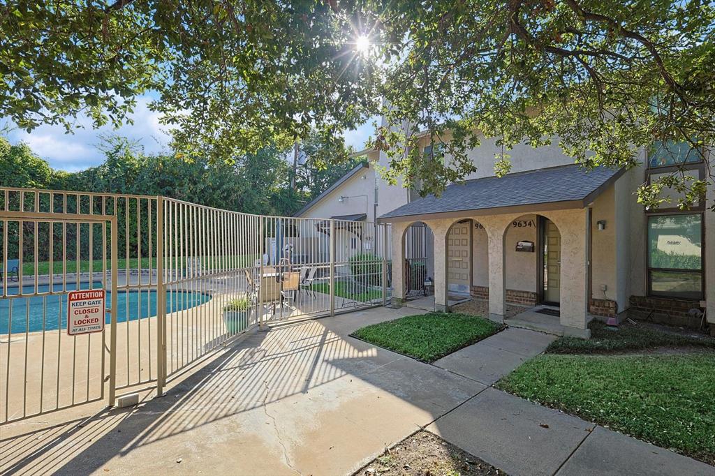 a view of a house with backyard and porch