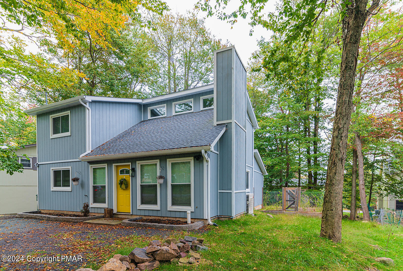 front view of a house with a yard