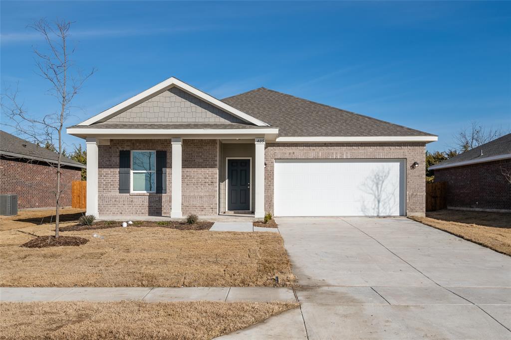 a front view of a house with yard