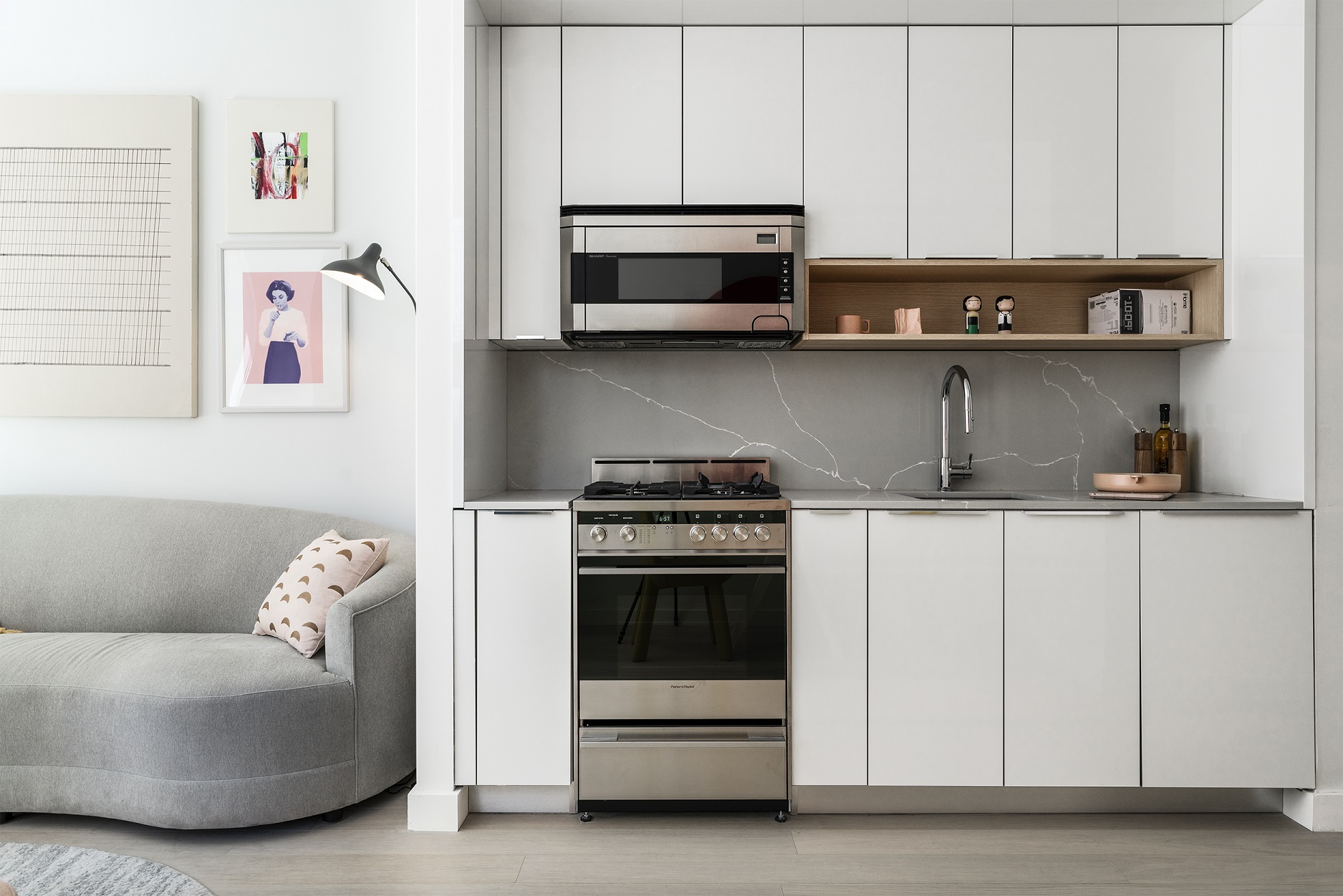 a kitchen with stainless steel appliances granite countertop a stove and a microwave