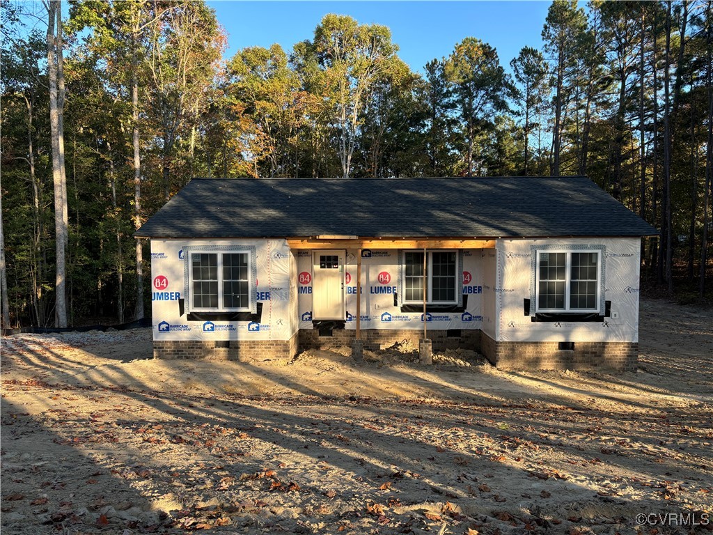 a view of a house with backyard porch and sitting area