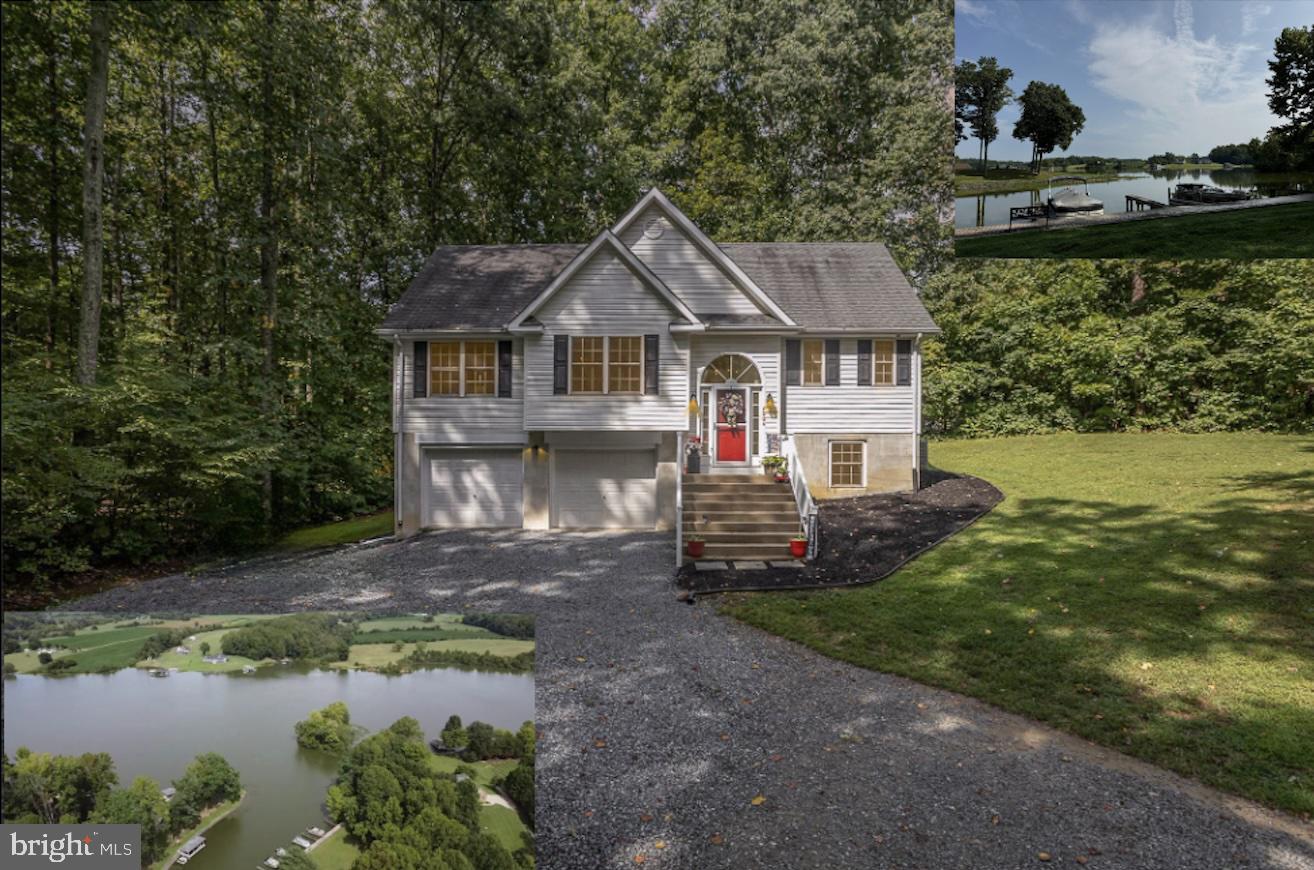 a view of a house with a yard and a garden