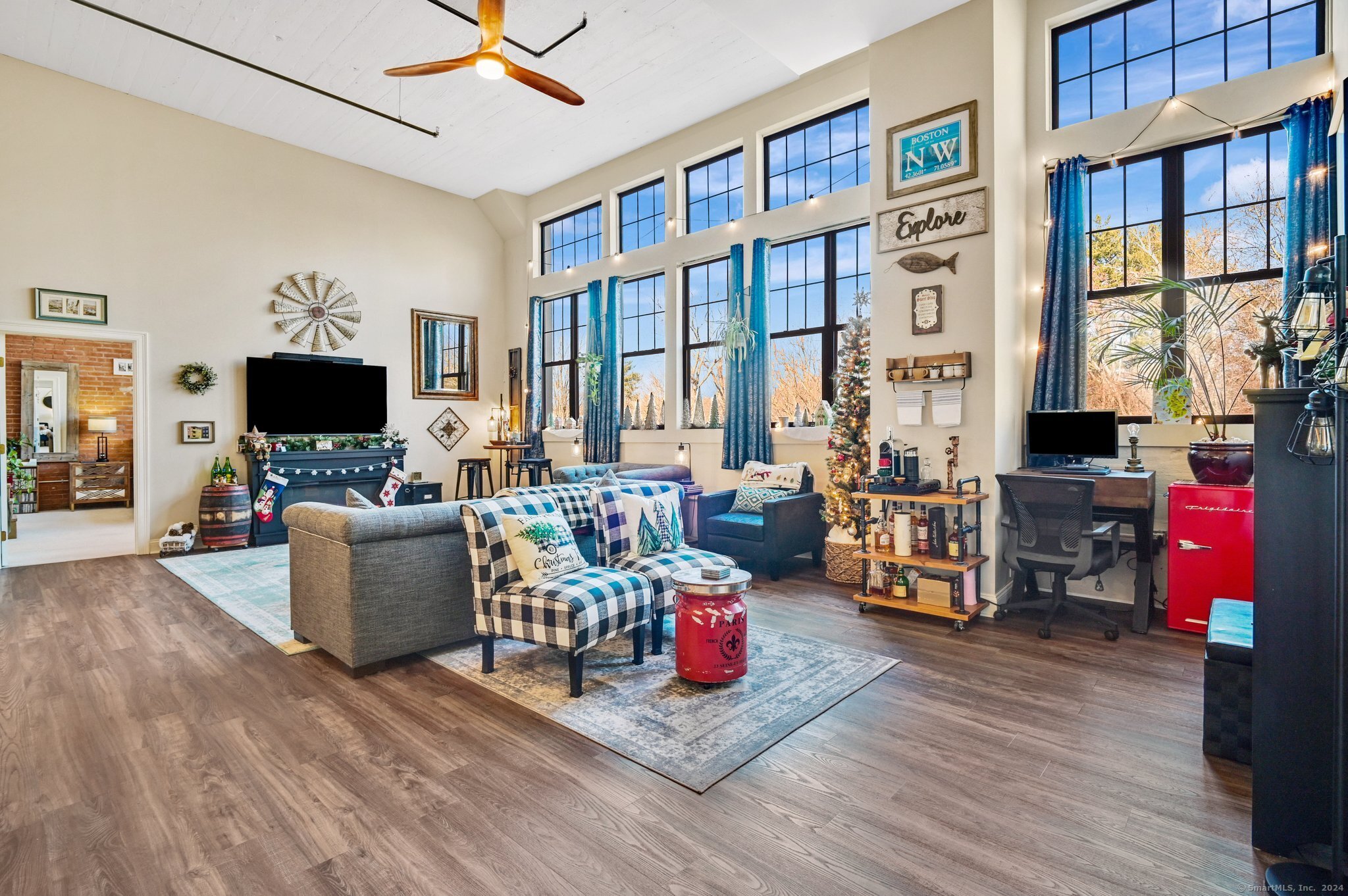 a living room with furniture and a flat screen tv