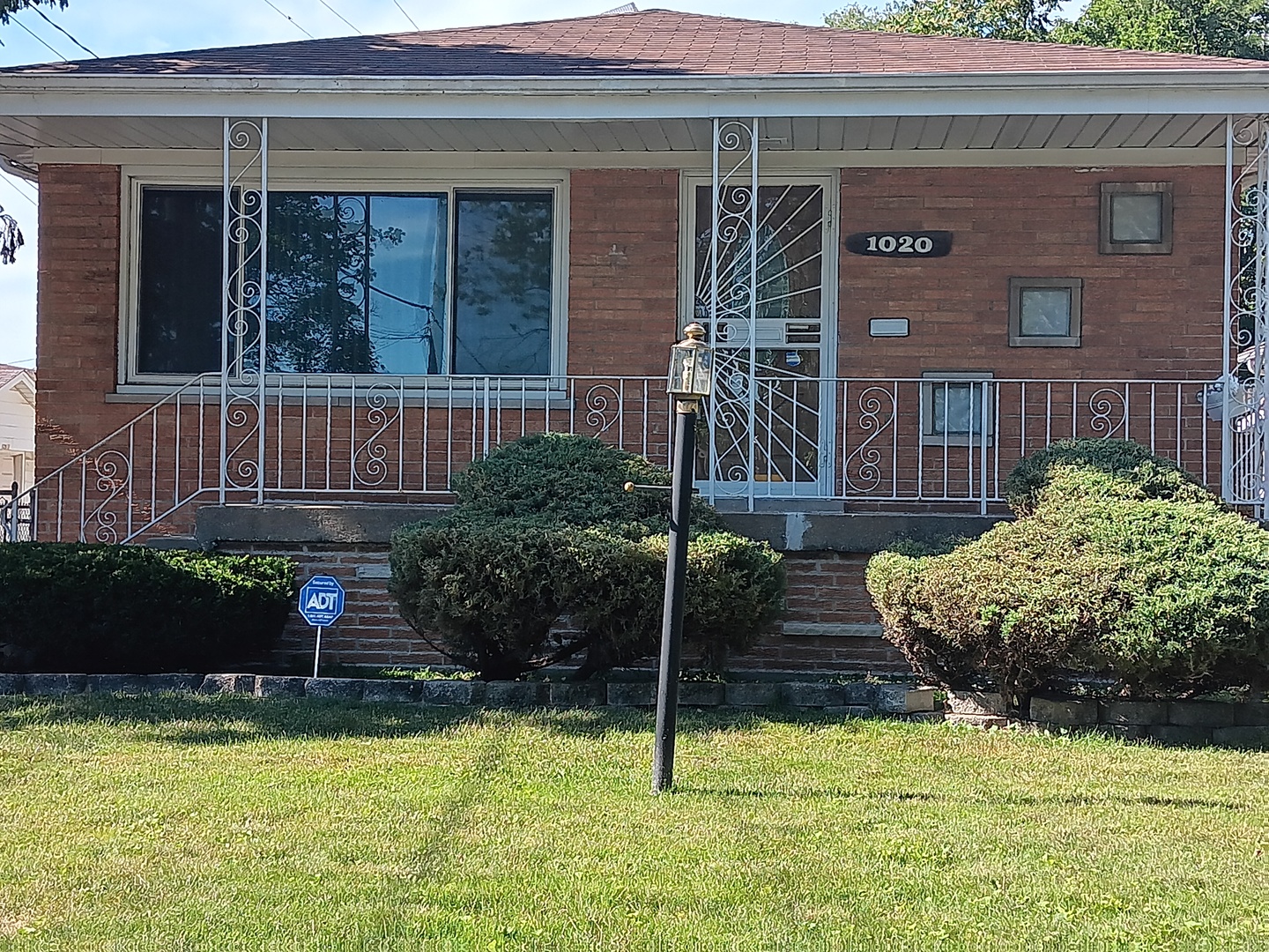 a view of a house with swimming pool and porch with furniture