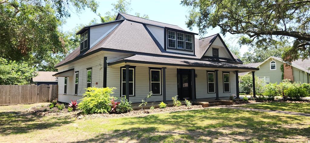 a front view of a house with a yard outdoor seating and yard