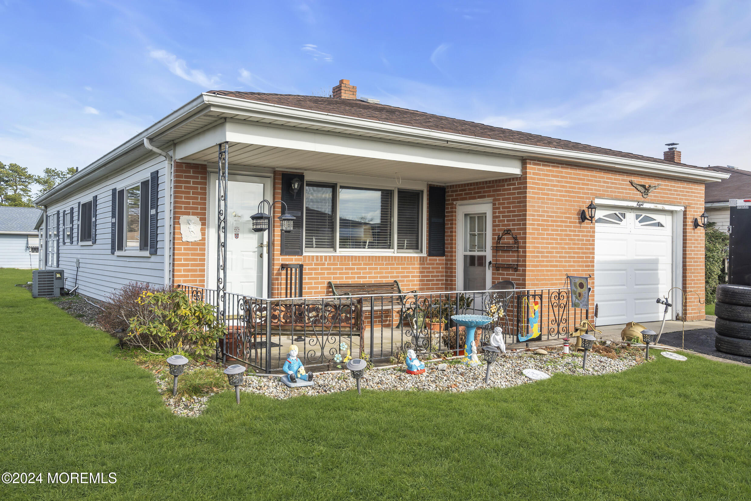 swimming pool with outdoor seating and yard