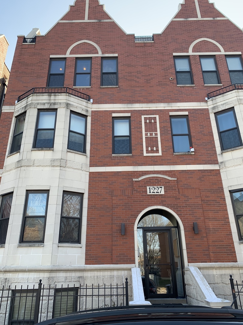 a front view of a building with windows