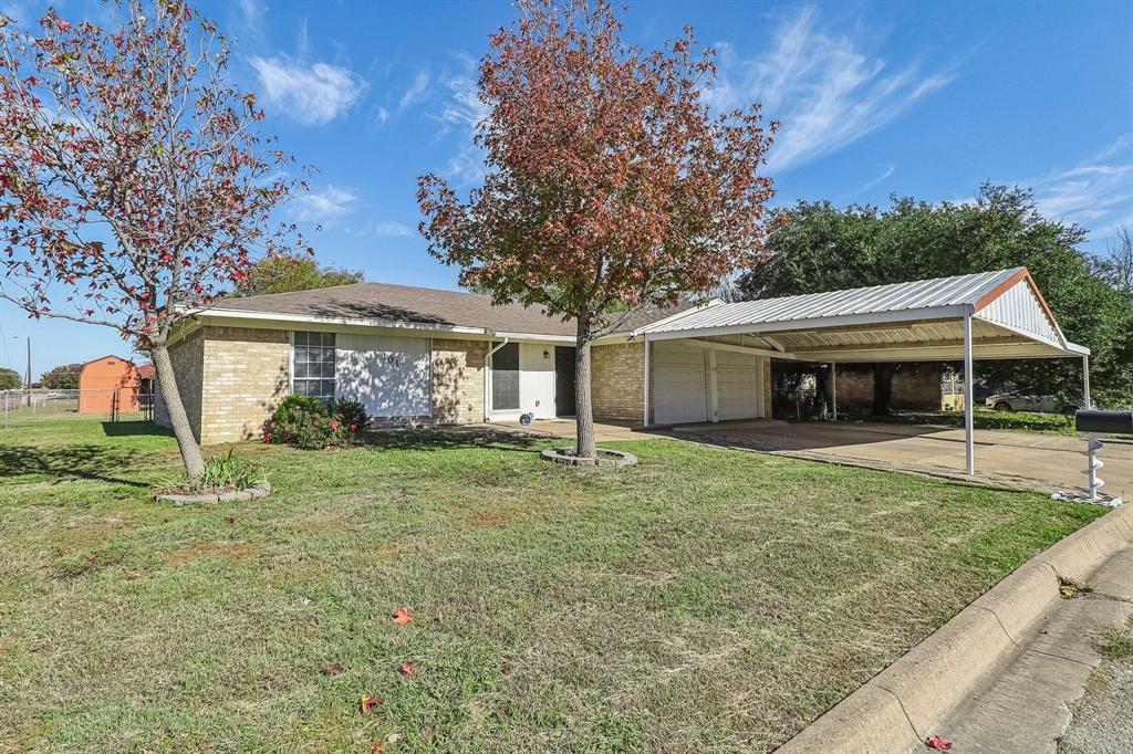 front view of a house with a yard