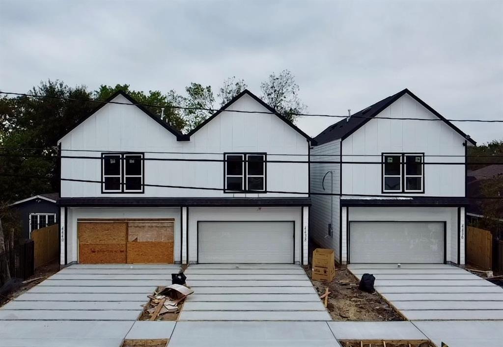 a front view of a house with a garage