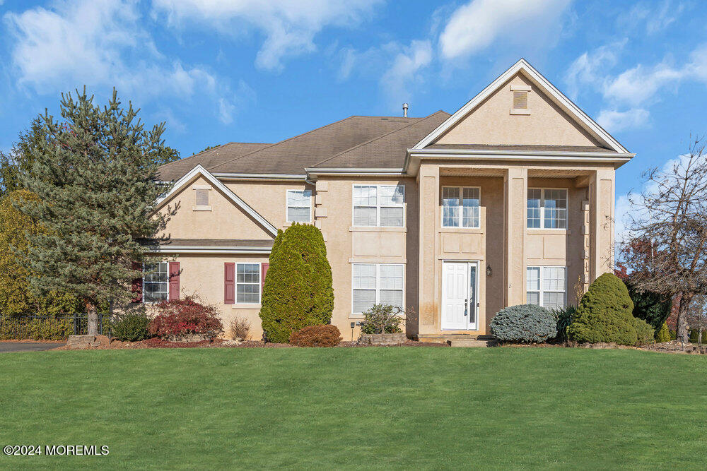 a view of a house with a backyard