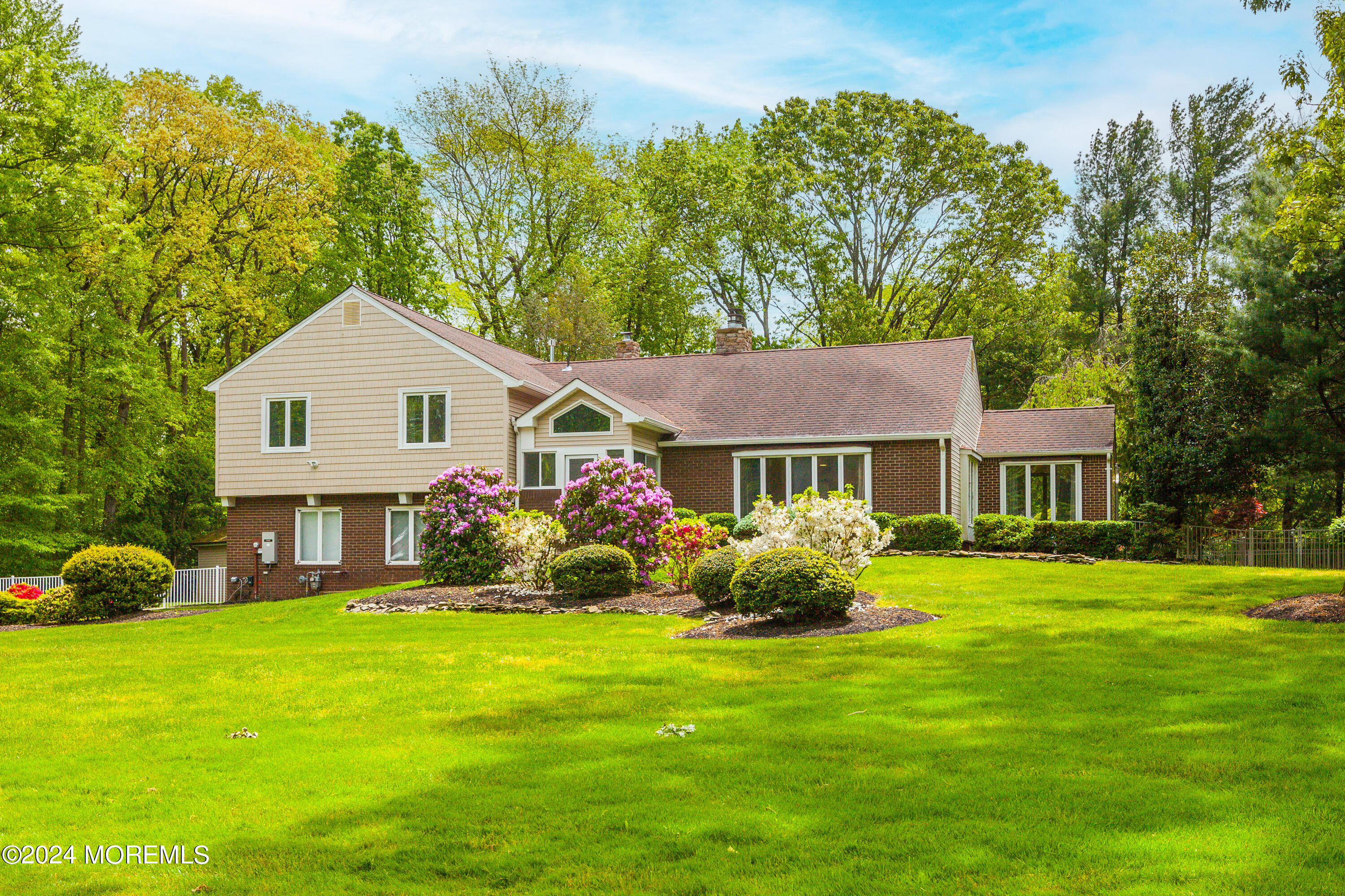 a front view of a house with garden